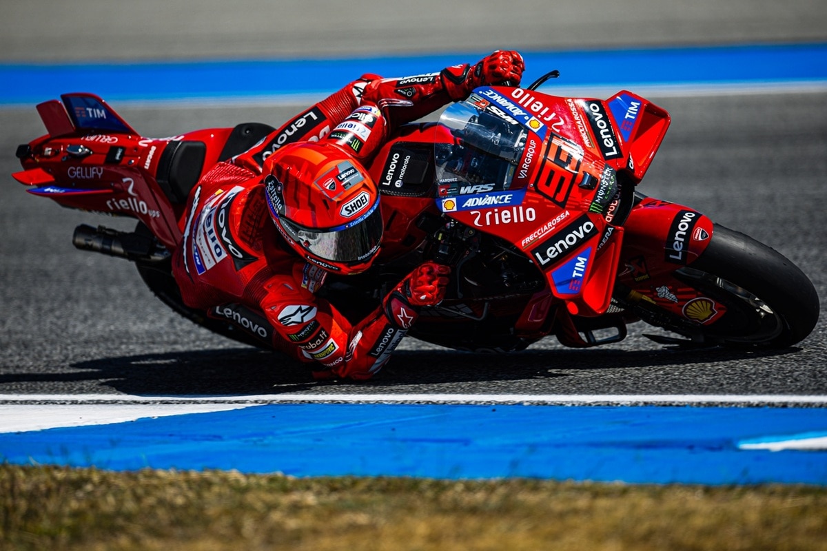 Marc Márquez on the Ducati Lenovo MotoGP bike leaning into a corner