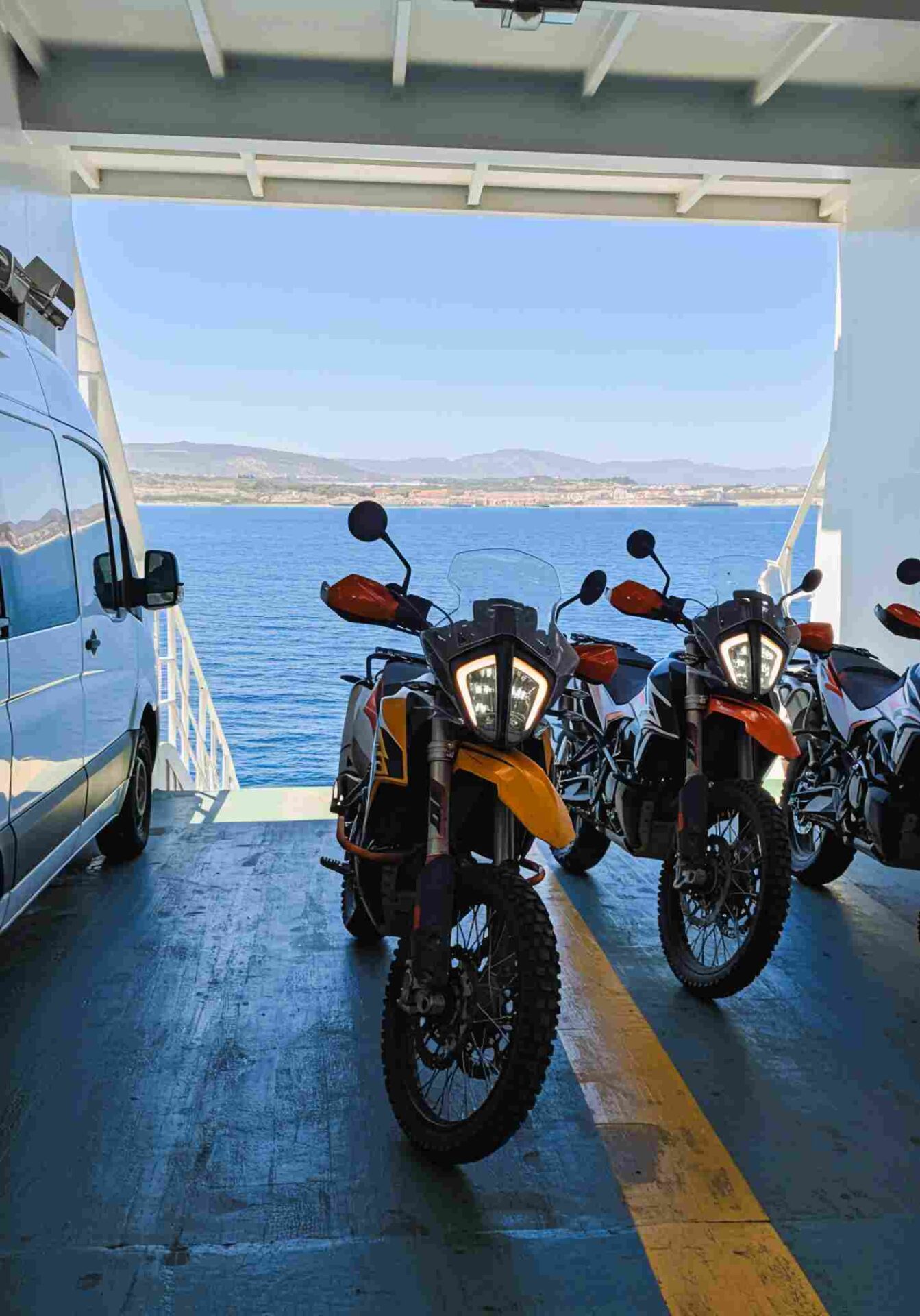KTM adventure bikes on the ferry deck crossing the Strait of Gibraltar