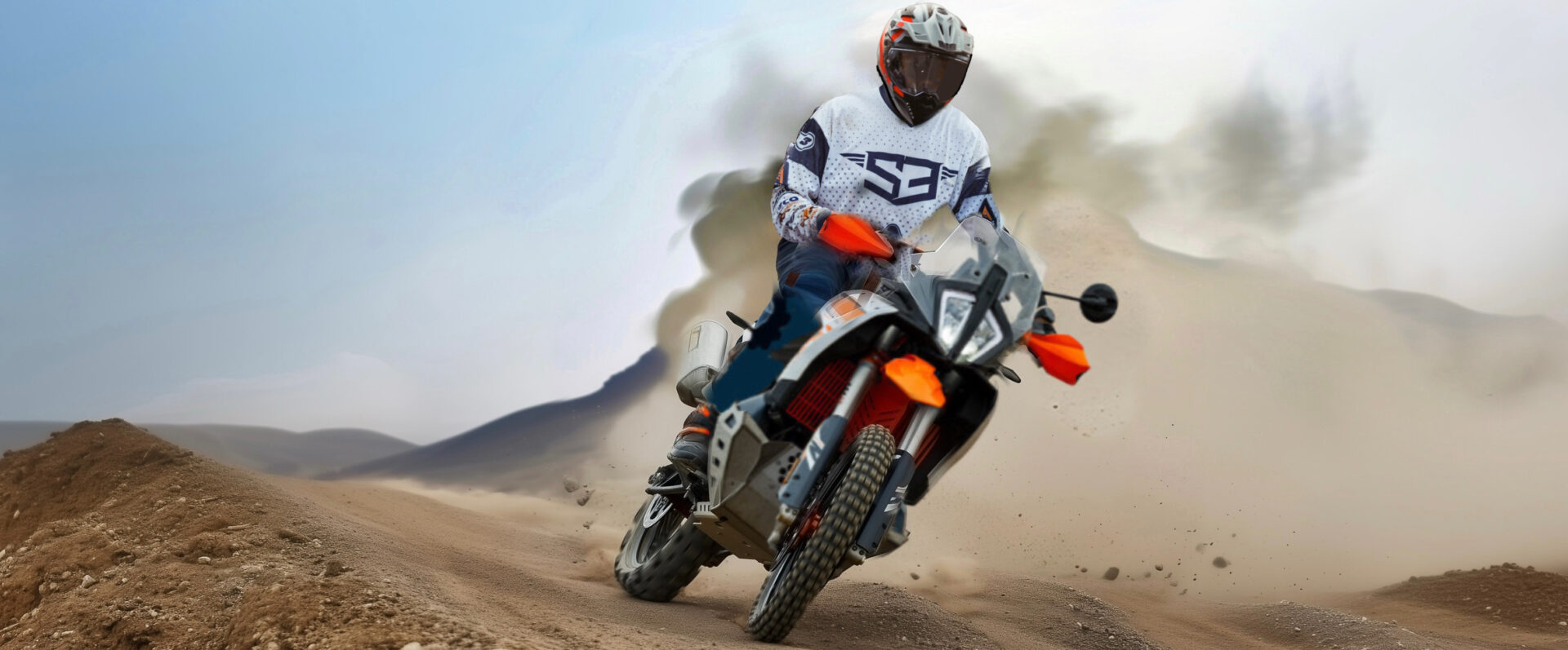 Rider on a KTM adventure bike kicking up desert dust on the African Sahara Adventure tour