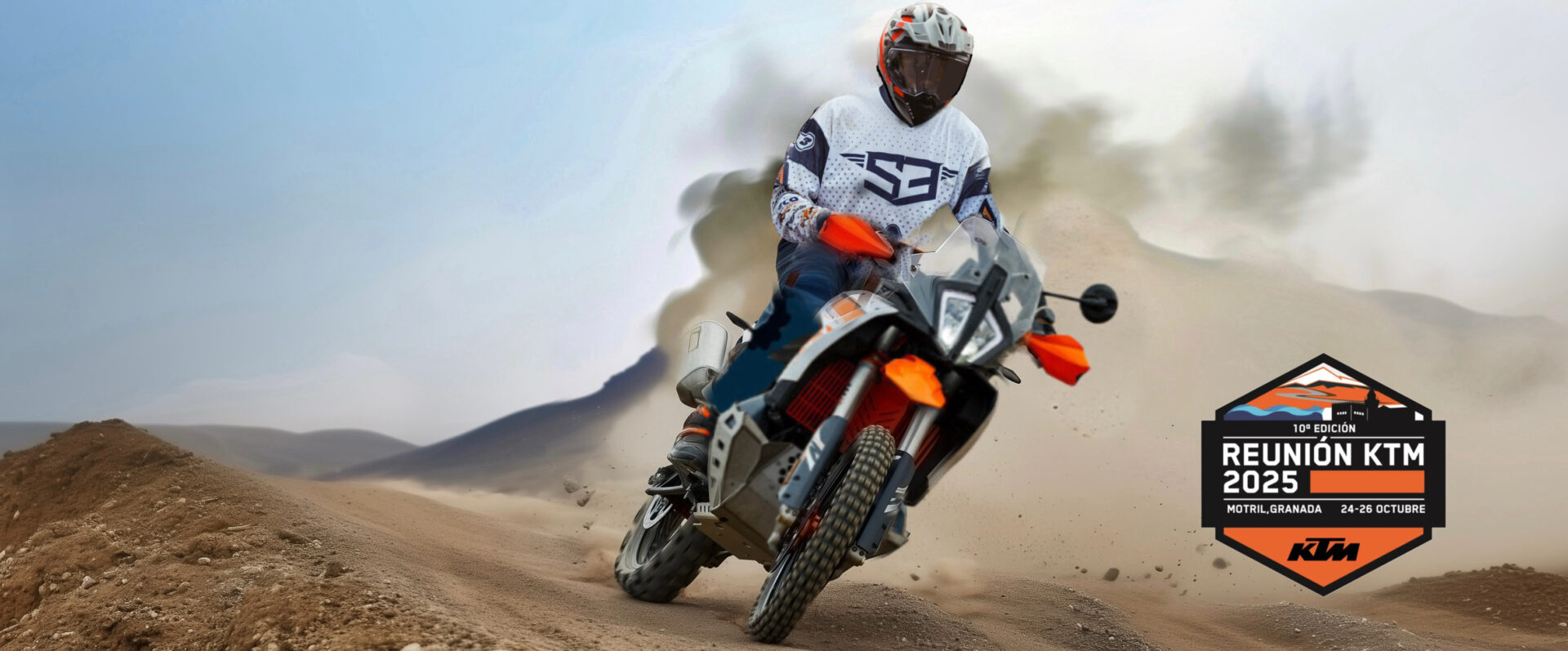 Rider on a KTM adventure bike kicking up dust at the KTM Spanish Meeting