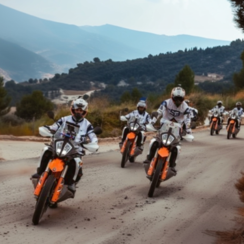 Group of riders on KTM adventure bikes on a mountain road in the Sierra Nevada, Andalusia