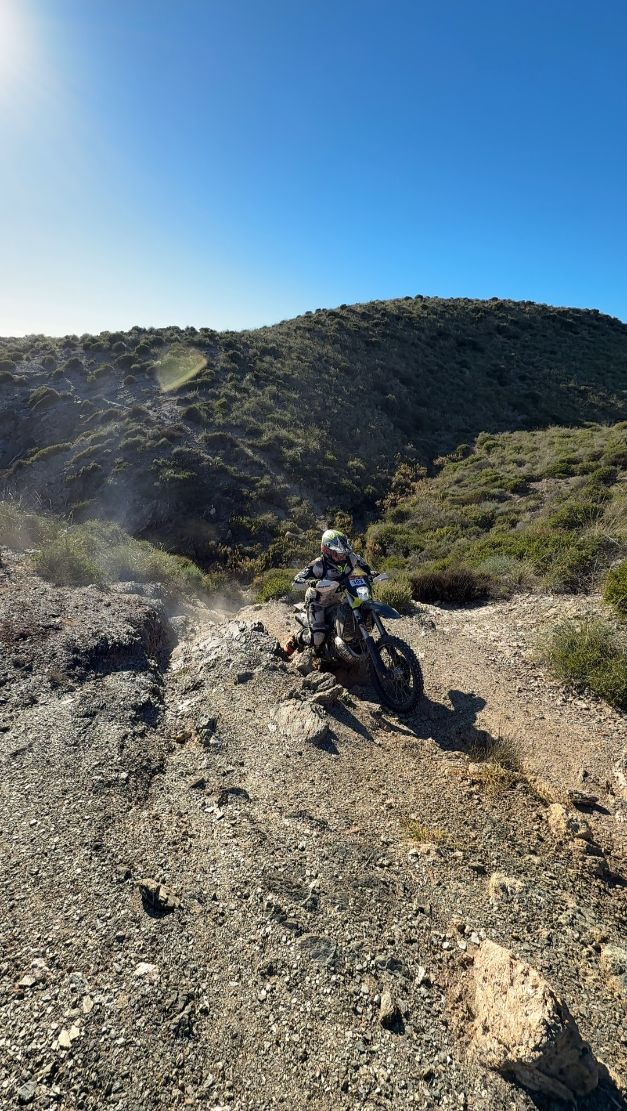 Enduro rider on a loose rocky trail in the hills of Murcia